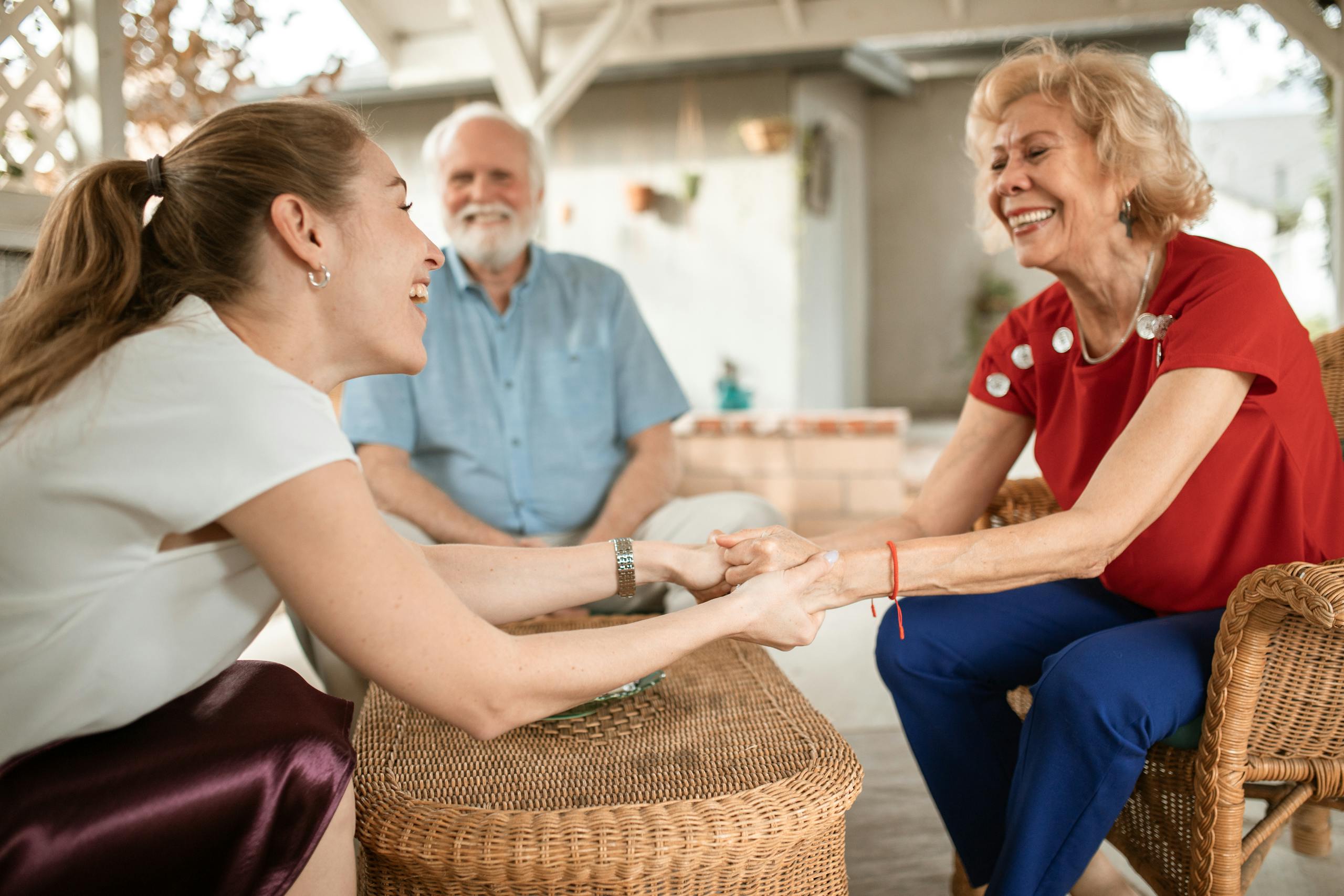 Adult child and senior parent in gentle conversation