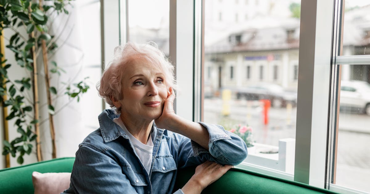 Senior woman reflecting quietly at home